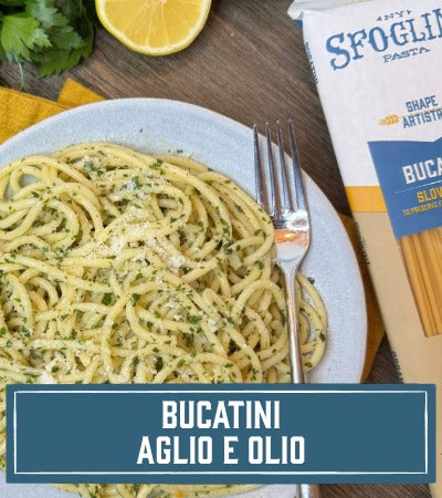 Sfoglini Pasta Recipe: Bucatini Aglio e Olio on a plate with a fork, next to a bag of Sfoglini pasta. With text overlay "Bucatini Aglio e Olio"
