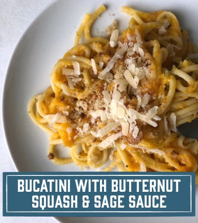 Sfoglini Pasta Recipe: long noodles on a white plate with text overlay "Bucatini with butternut squash and sage sauce"