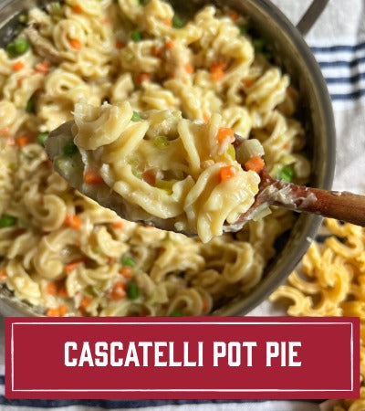 Sfoglini Pasta Recipe: Cascatelli pot pie with noodles, carrots, and peas in a pan. with text overlay "Cascatelli Pot Pie"