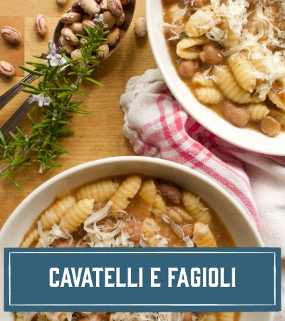 Sfoglini Pasta Recipe: Two bowls of Sfoglini pasta e fagioli with beans and herbs on a wooden surface. With text overlay "Cavatelli e Fagioli"