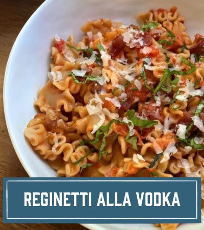 Sfoglini Pasta Recipe:  Pasta dish with tomato sauce and basil in a white bowl, labeled 'Reginetti alla Vodka'.