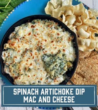 Sfoglini Pasta Recipe: Trumpet pasta spinach artichoke dip mac and cheese in a skillet with crackers on a blue plate. with text overlay"Spinach artichoke dip mac and cheese"