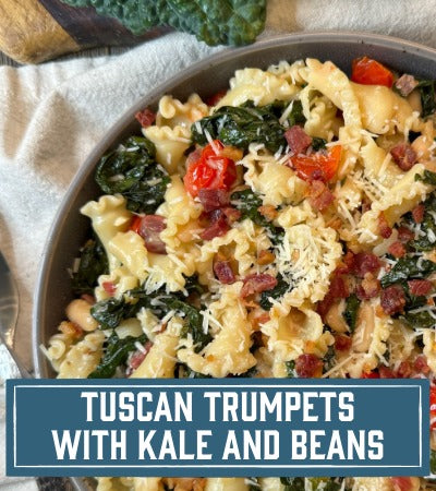 Sfoglini Pasta Recipe: pasta dish with kale and beans in a bowl, labeled 'Tuscan Trumpets with Kale and Beans'.