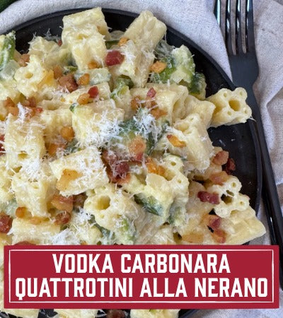 Sfoglini Pasta Recipe:  dish with vegetables and cheese on a black plate, labeled 'Vodka Carbonara Quattrotiná alla Nerano'.