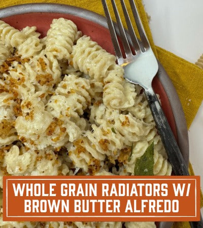 Sfoglini Pasta Recipe: Pasta dish with a fork on a plate, text overlay 'Whole Grain Radiators w/ Brown Butter Alfredo'.