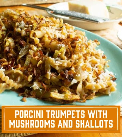 Sfoglini Pasta Recipe: Plated dish of porcini trumpets with mushrooms and shallots on a wooden table. With text overlay "porcini trumpets with mushrooms and shallots"