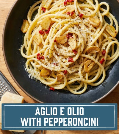 Bucatini dish with garlic, oil, and pepperoncini on a plate with 'Aglio e Olio with Pepperoncini' text.