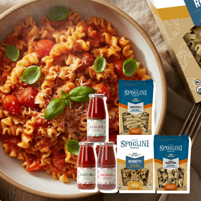 Sfoglini Classic Italian Pantry Set - Pasta dish with basil leaves, Spoglini pasta boxes and bags (Spacatelli, Garlic Radiators, Reginetti) , and sauce bottles on a wooden surface.
