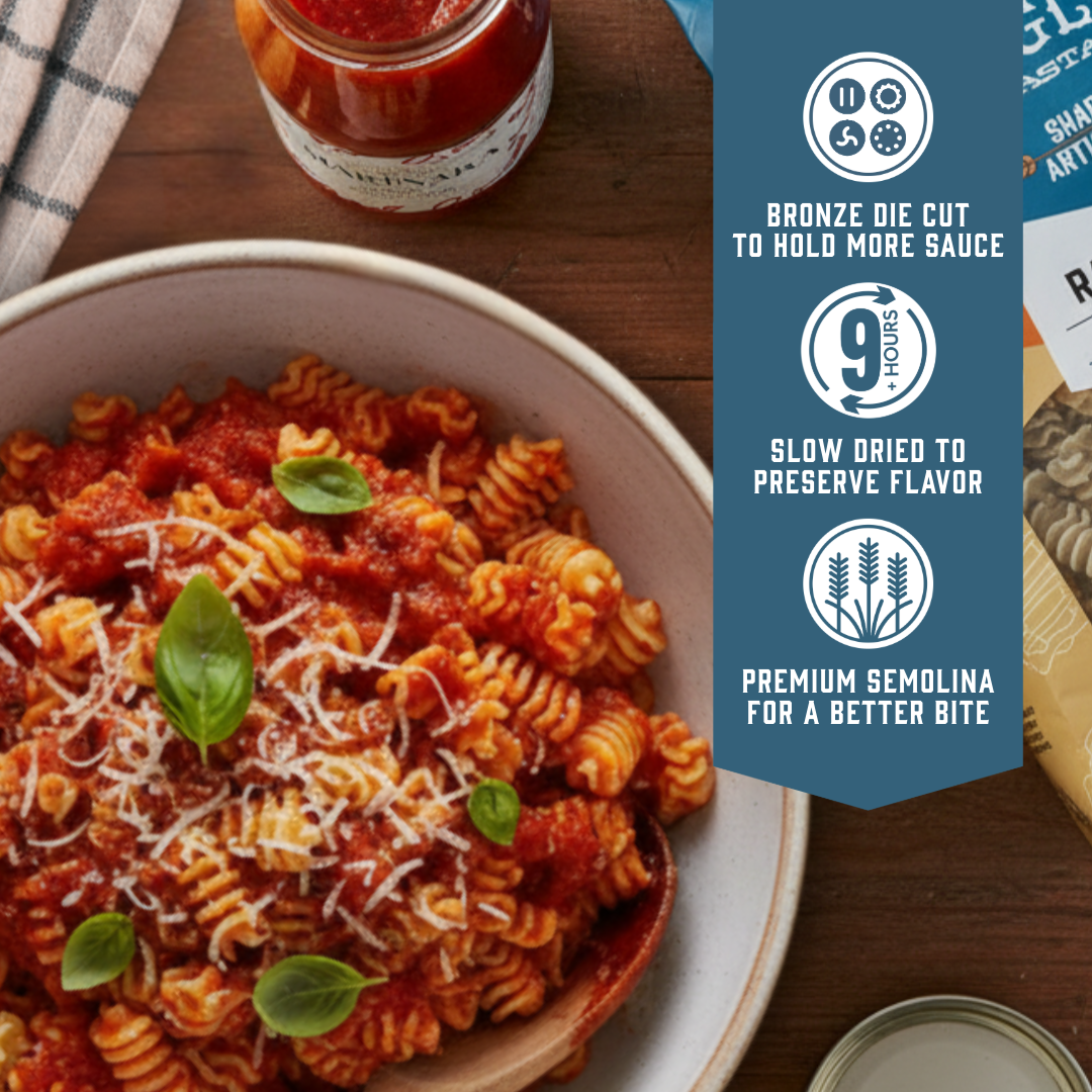 Pasta dish with sauce and basil leaves on a wooden table, with product features displayed on the right. Sfoglini Garlic Radiators - Bronze die cut to hold more sauce. Slow dried to preserve flavor. Premium semolina for a better bite.