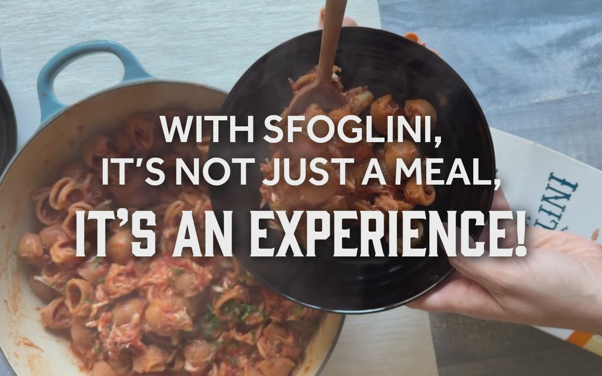 Video of Sfoglini Calabrian Chili Lumache with crab sauce being plated. With the text "With Sfoglini, it's not just a meal, it's an experience!"