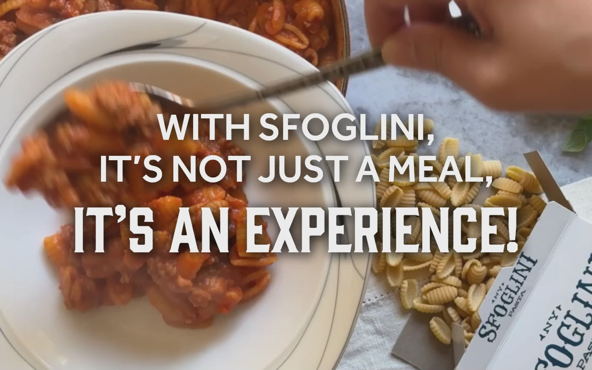 Video of Sfoglini Saffron Malloreddus with sausage alla Campidanese sauce being plated. With the text "With Sfoglini, it's not just a meal, it's an experience!"